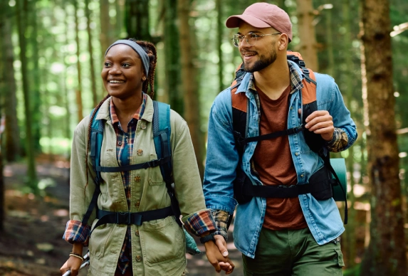 Hiking couple, holding hands